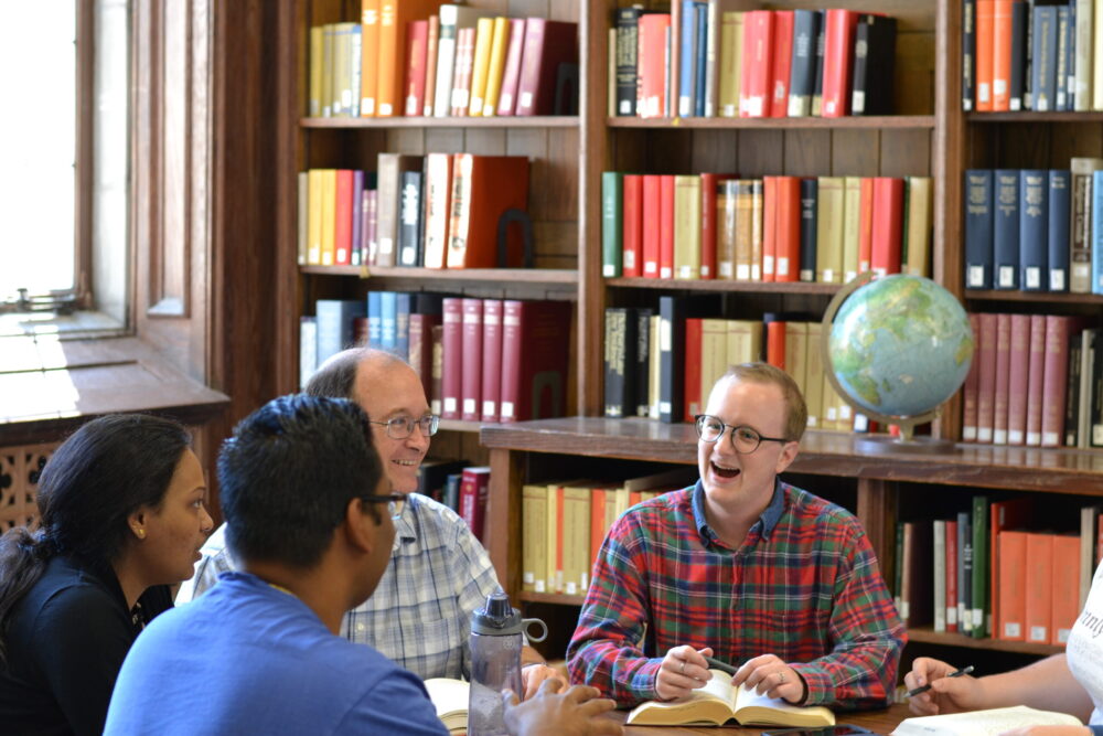 students talking in the library