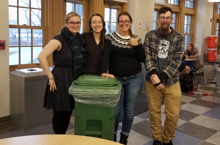sustein gets staff and students by a recycling bin