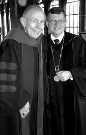 Garrett-Evangelical 2002 Distinguished Alum Arthur J. Landwehr II poses for a photo in graduation robes