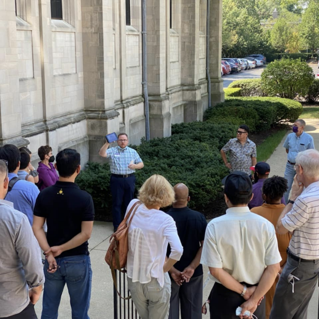 Daniel Smith leading a tour of symbols on Garrett's campus building