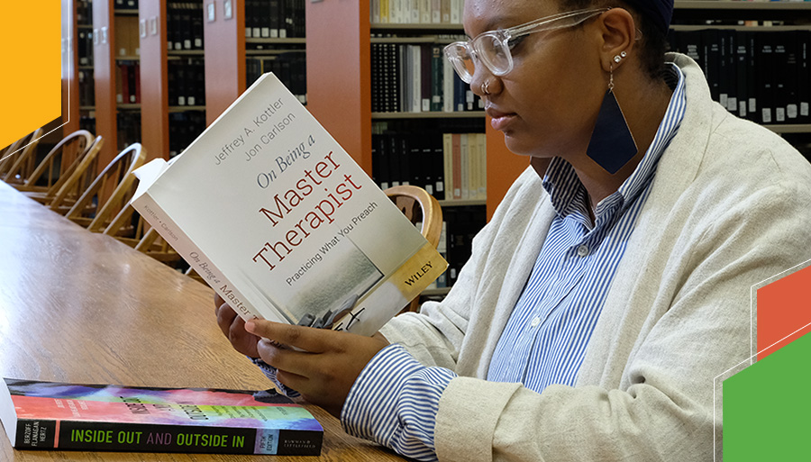 student reading in the library